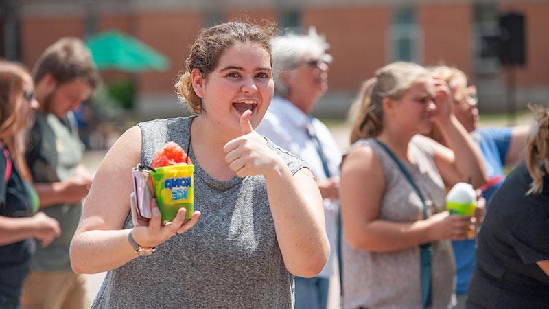 student with sno cone